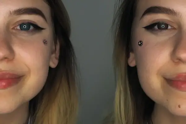 Dwie połowy twarzy młodej kobiety z makijażem i błyszczącym kolczykiem Christina piercing.